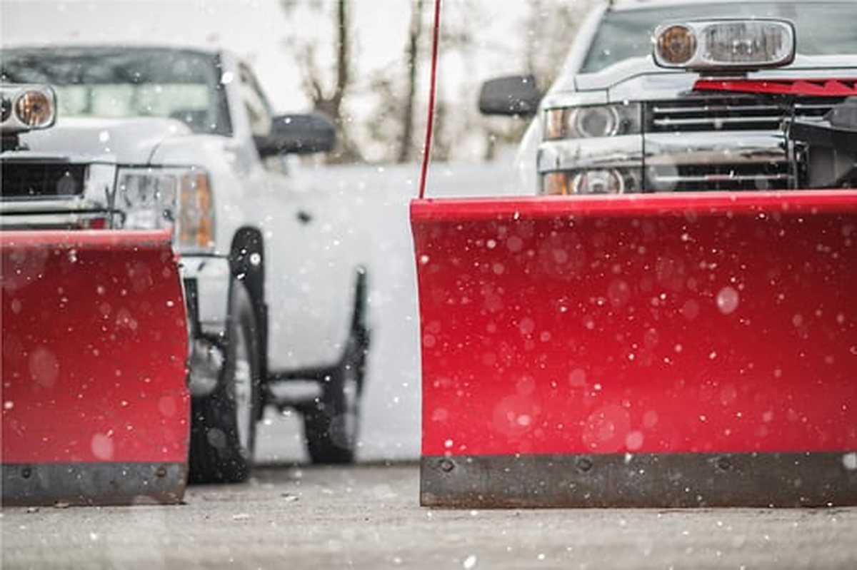 Plow trucks clearing snow